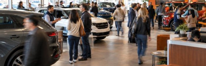 Busy dealership showroom during a sales event